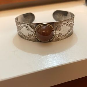 Silver cuff bracelet with orange brown stone